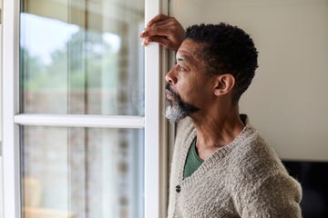 pensive man looking out of window