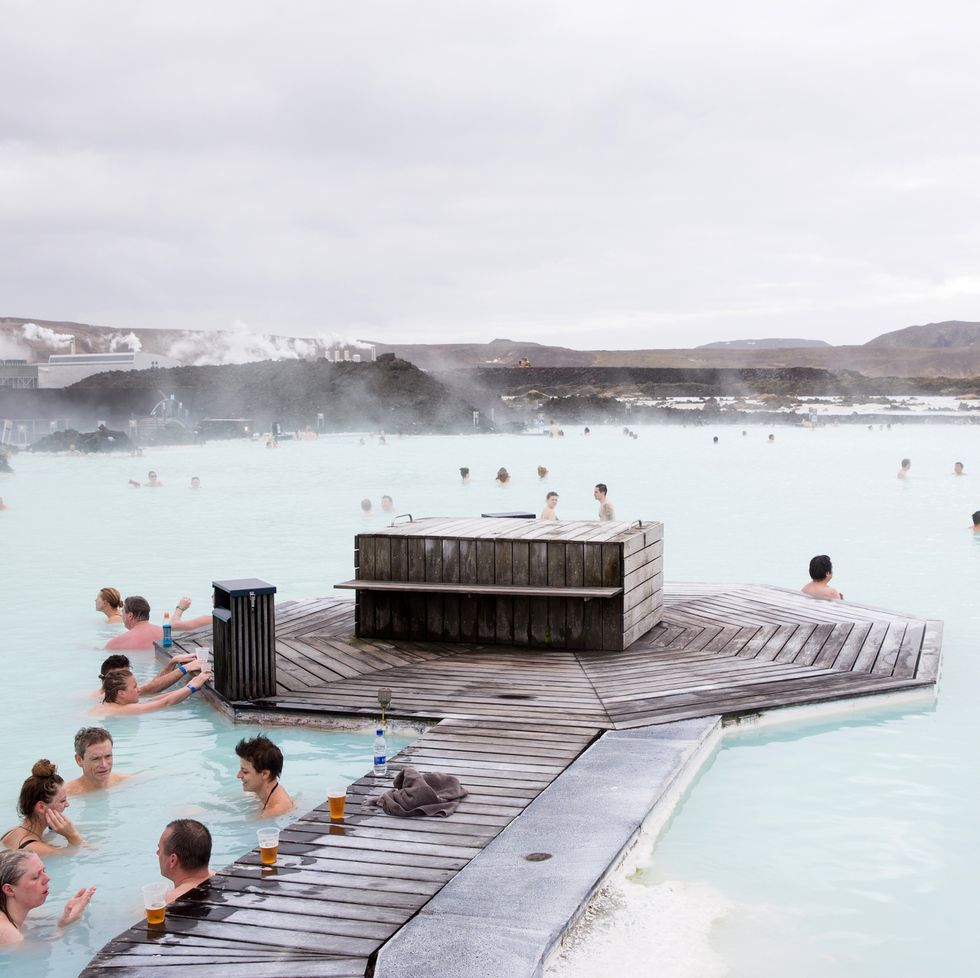 people at the blue lagoon , iceland