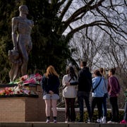 people-embrace-at-the-memorial-that-formed-around-the-news-photo-1676473162.jpg?crop=0.665xw:1.00xh;0.183xw,0&resize=180:*