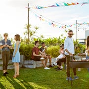 People enjoying Asado party at backyard people enjoying asado party at backyard