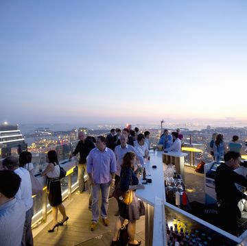 people enjoying sunset from rooftop bar
