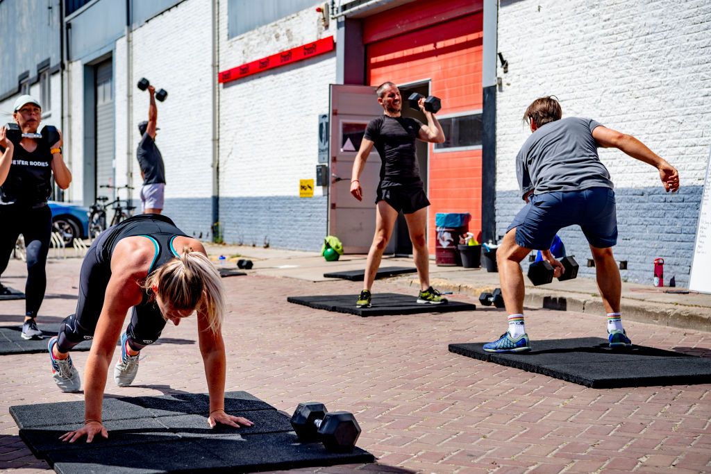 people exercise outside crossfit gym amid coronavirus crisis