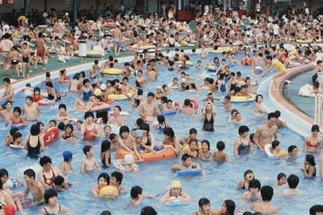 swimmers surrounding pool