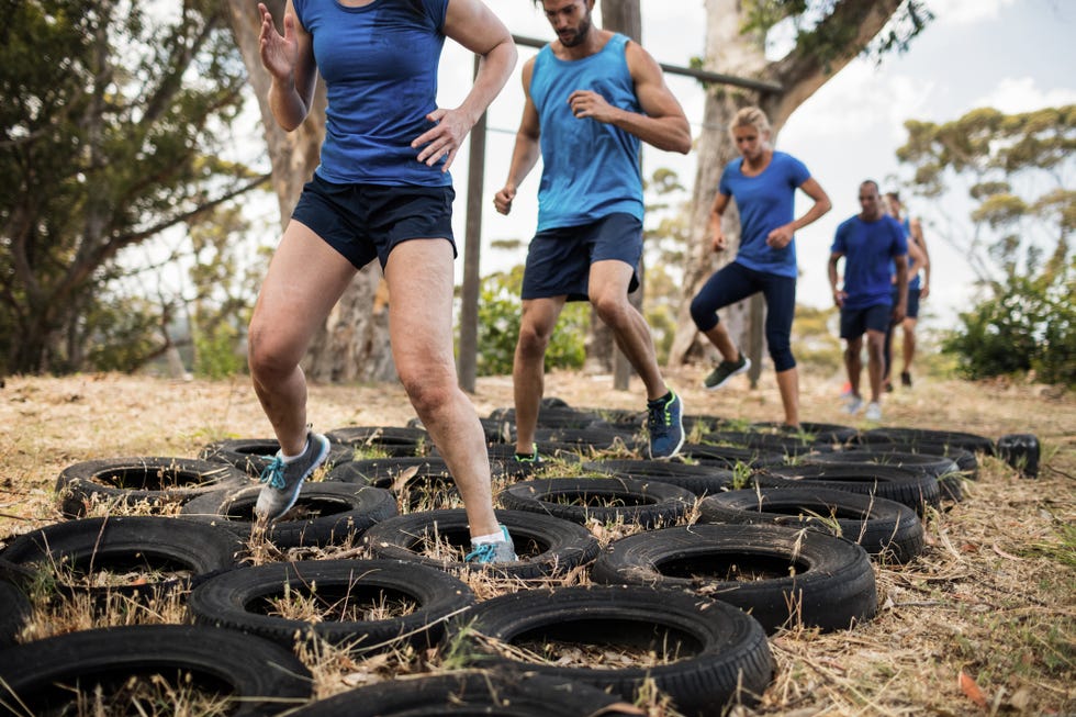 People receiving tire obstacle course training