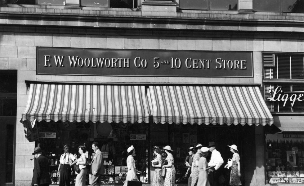 People walk past Woolworth Store