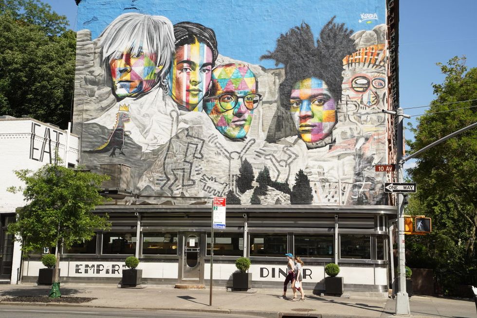 a large mural depicting andy warhol, frida kahlo, keith haring and basquiat in the chelsea neighborhood of manhattan