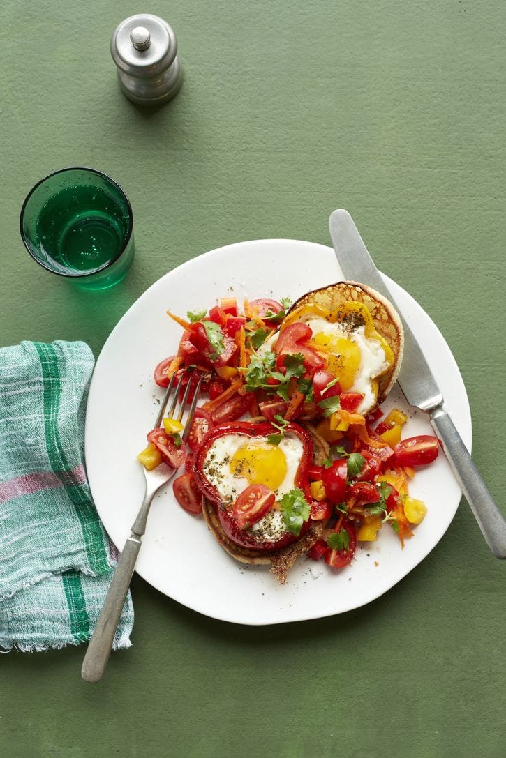 Healthy Easter Recipes - Pepper Egg Breakfasts a white plate topped with sauteed chopped peppers and eggs cooked in sliced peppers, eggs are a good housekeeping pick for a healthy weight loss food