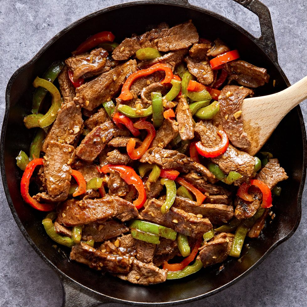 steak with sliced red and green peppers