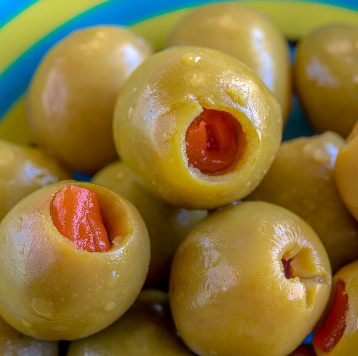 Pepper stuffed green olives in a bowl