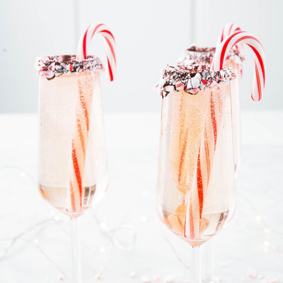 peppermint bark mimosas in a champagne glass