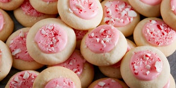 peppermint meltaway cookies topped with pink icing and crushed peppermints