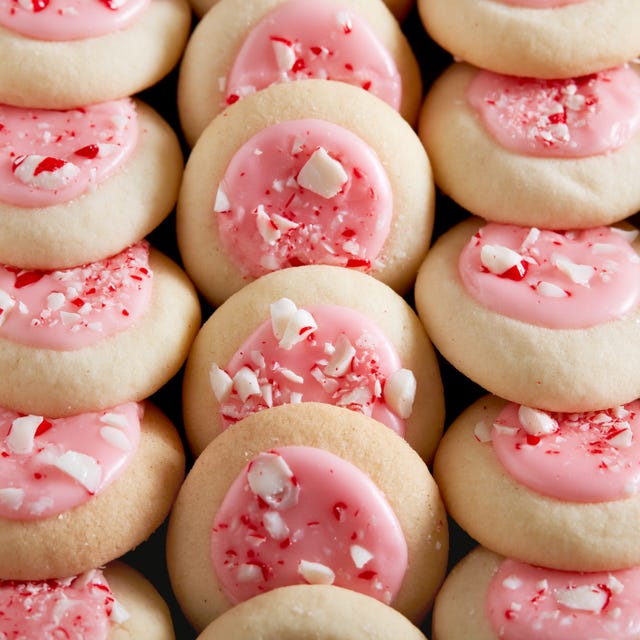 peppermint meltaway cookies topped with pink icing and crushed peppermints