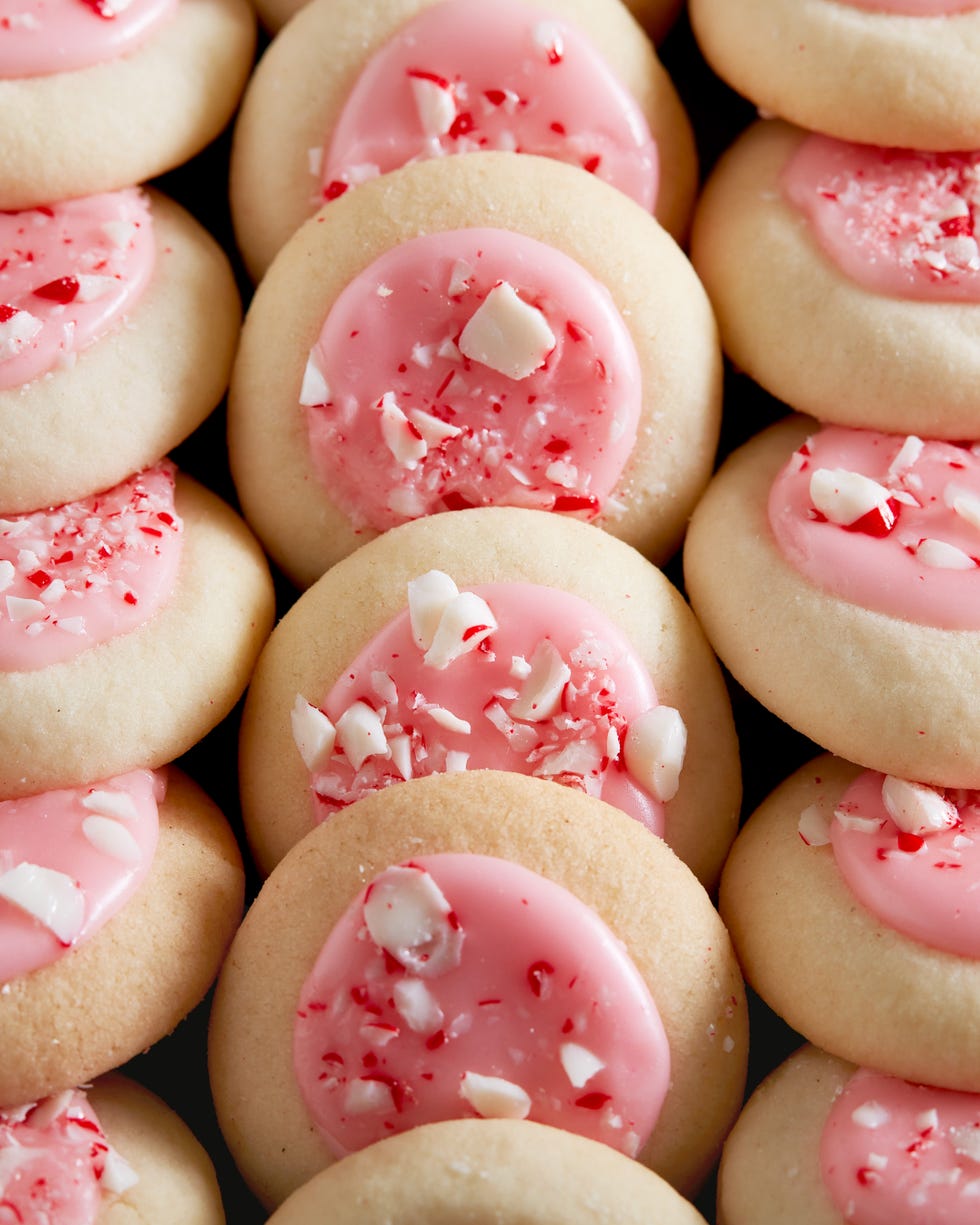 peppermint meltaway cookies topped with pink icing and crushed peppermints