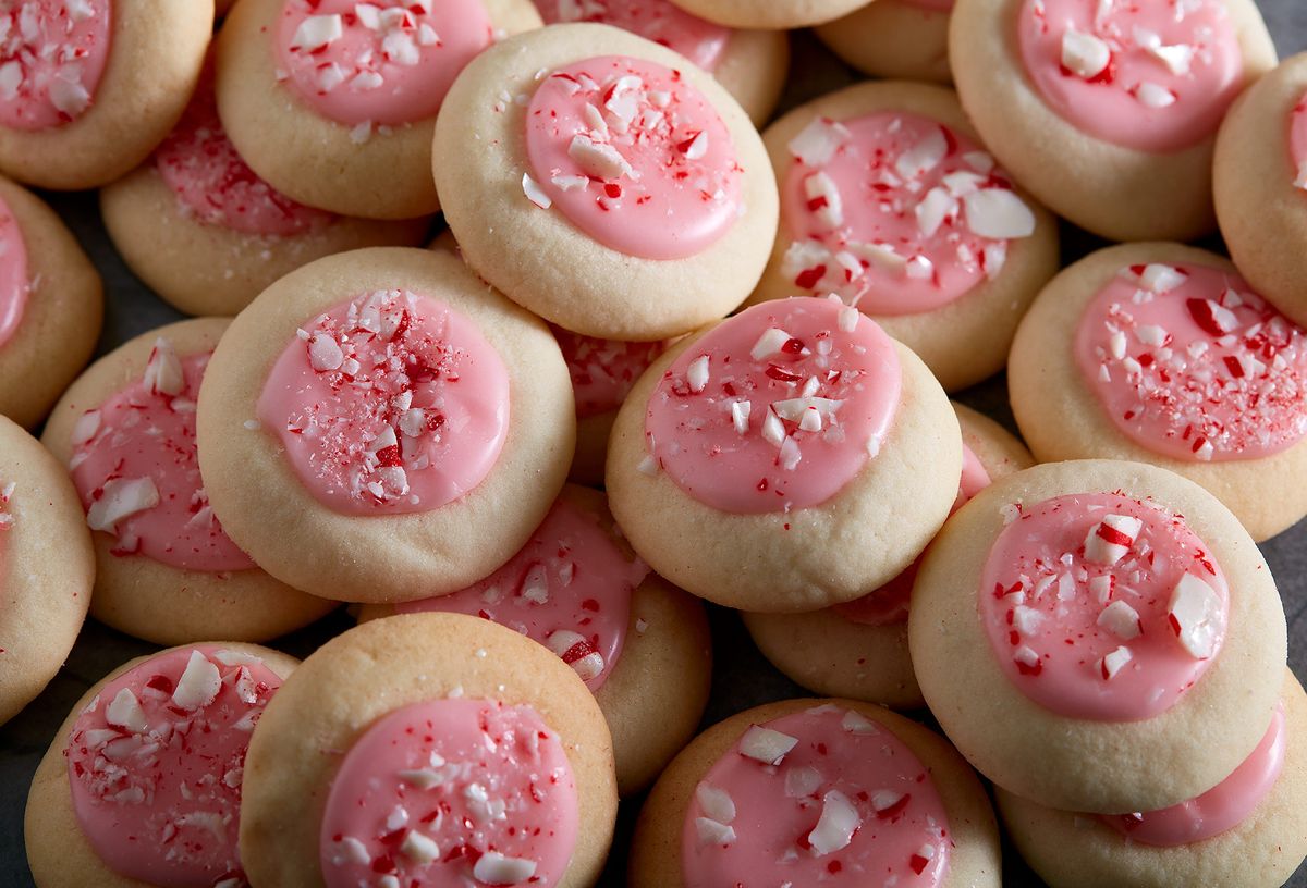 peppermint meltaways cookies topped with pink icing and crushed peppermint cookies