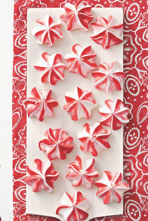 peppermint meringues on white board red background