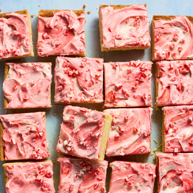 Peppermint Sheet Pan Bars cookie bars topped with pink ice and peppermint candy pieces