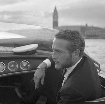 american actor paul newman, wearing a tuxedo and a bow tie, portrayed during a trip on a water taxi, a sailor cap on the dashboard, st mark square in the background, venice 1963 photo by archivio cameraphoto epochegetty images