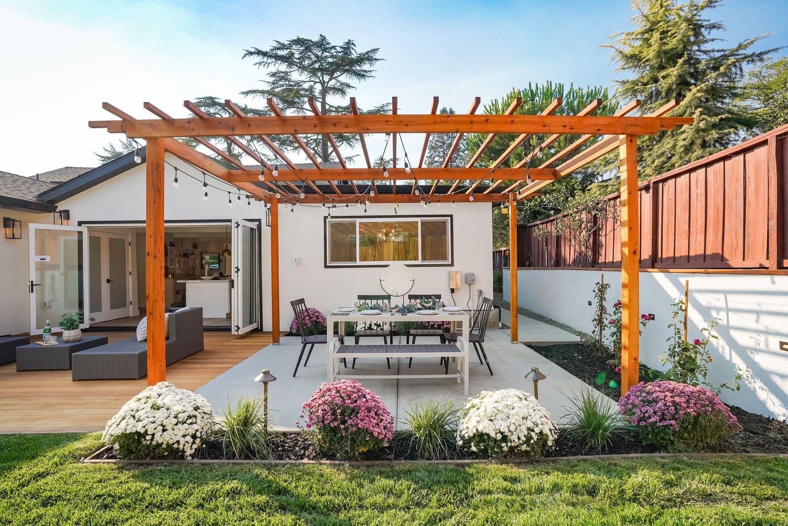 https://hips.hearstapps.com/hmg-prod/images/pergola-and-concrete-patio-yardzen-641b14f49969a.jpg