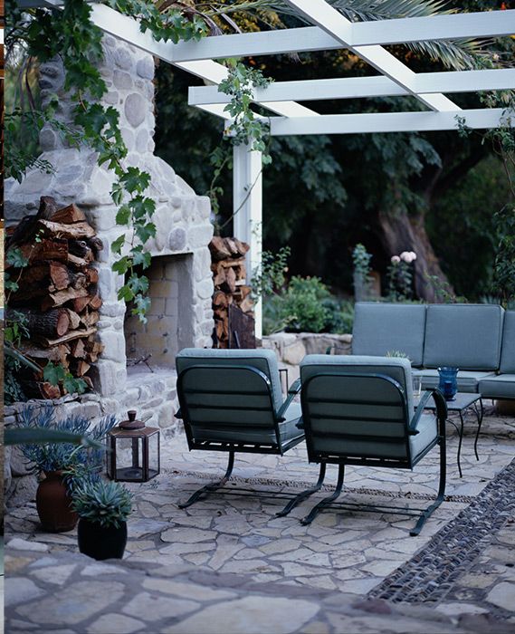 pergola ideas with fireplace patio chairs and a table