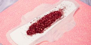 period pad with red glitter