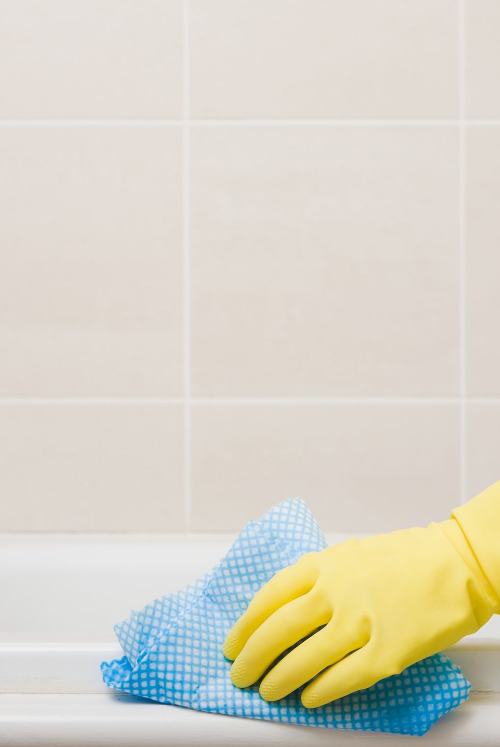 person cleaning bath