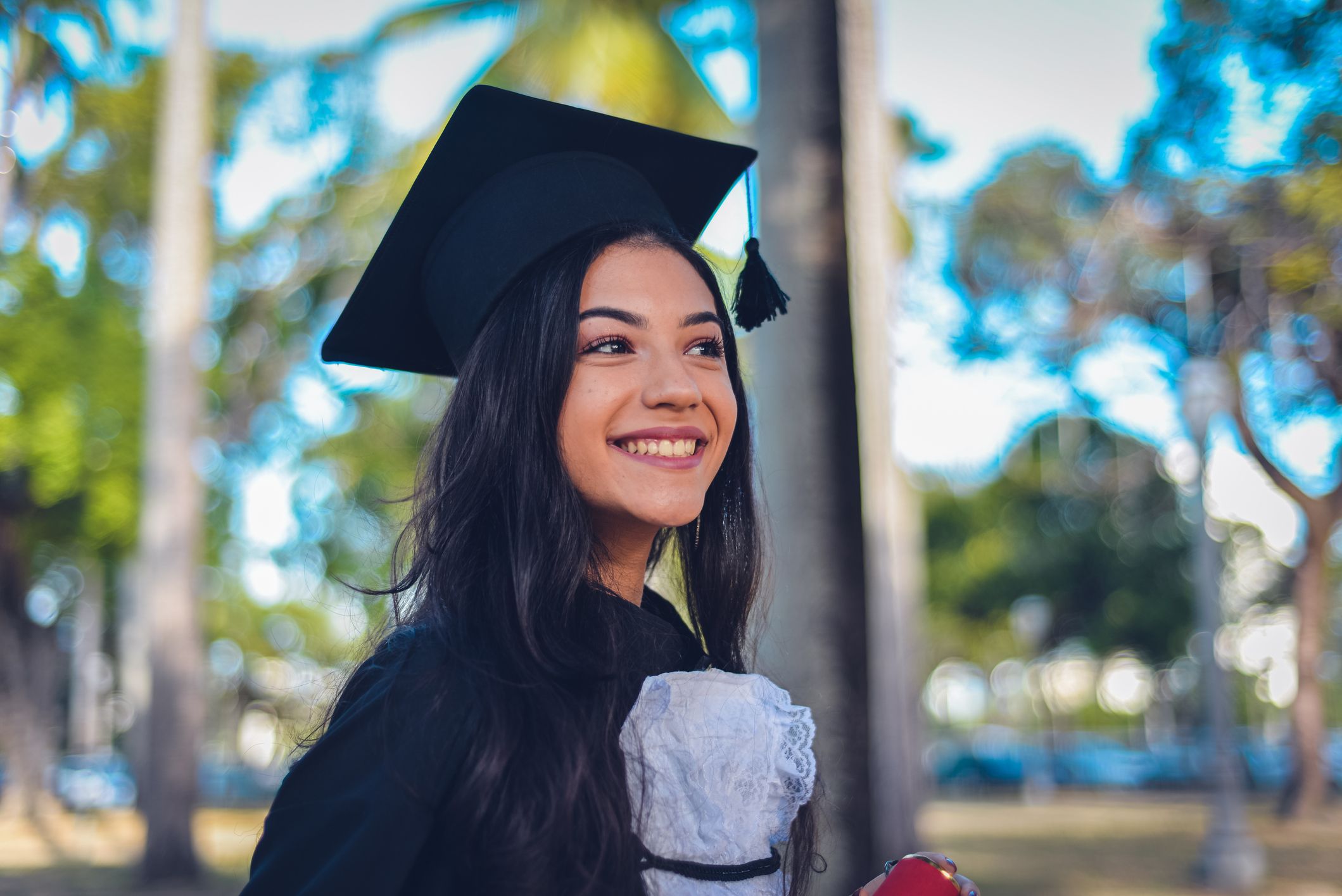 Graduation, university and portrait of mother with girl at academic  ceremony, celebration and achievement. Family, education and mom hugging  graduate daughter with degree or diploma on college campus Stock Photo |  Adobe