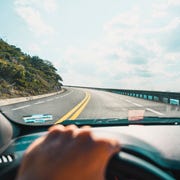 Personal perspective of person driving on mountain road personal perspective of person driving on mountain road