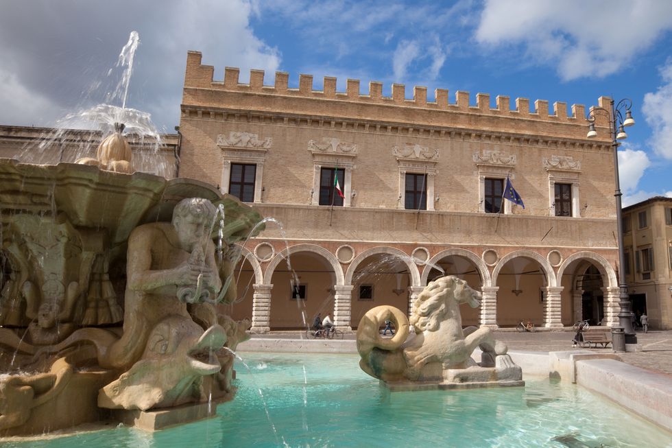 fountain and renaissance palace in pesaro, marches, italy