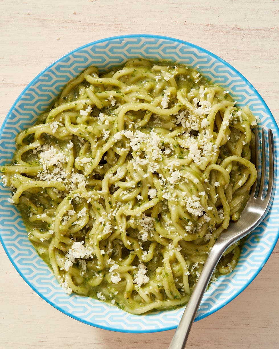 creamy green pesto ramen topped with a sprinkling of parmesan cheese