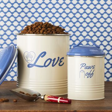 a group of white and blue containers with dog food in them