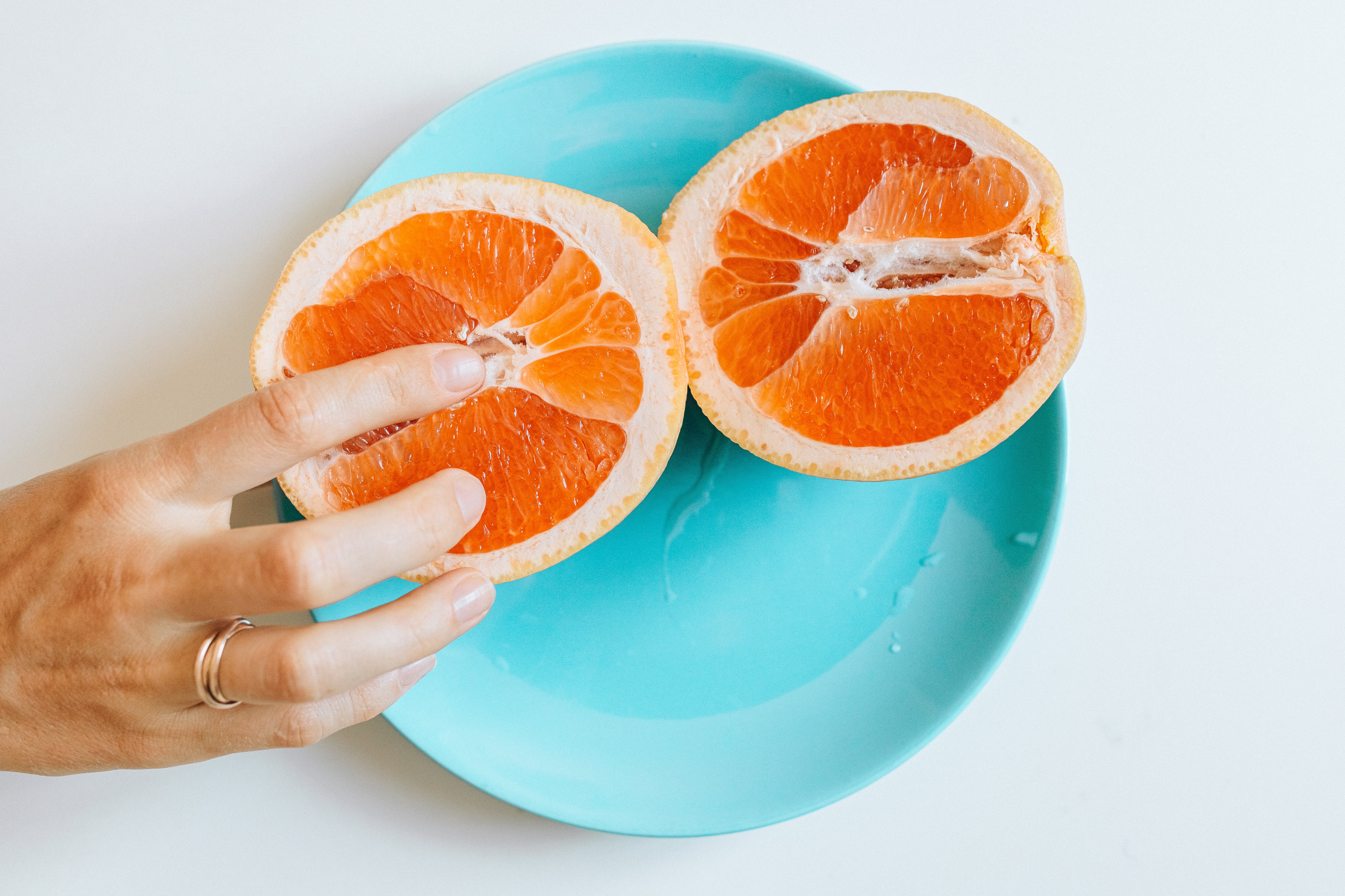 a person peeling an orange