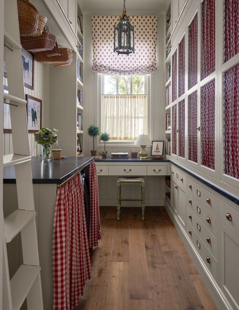 narrow galley kitchen with cabinets