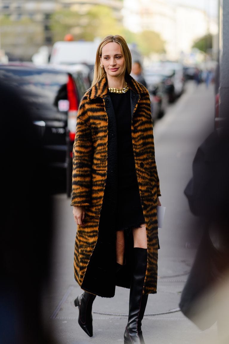 Clothing, Street fashion, Fashion, Fashion model, Fur, Outerwear, Footwear, Knee-high boot, Coat, Fashion show, 
