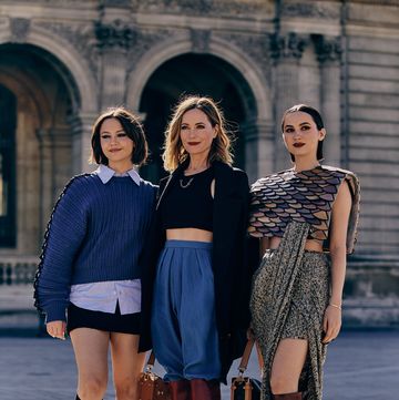 Emma Chamberlain Wears Lip Dress & Jean Boots for Loewe's Fashion Show –  Footwear News