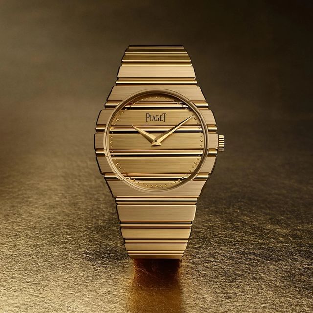 a watch with a gold band