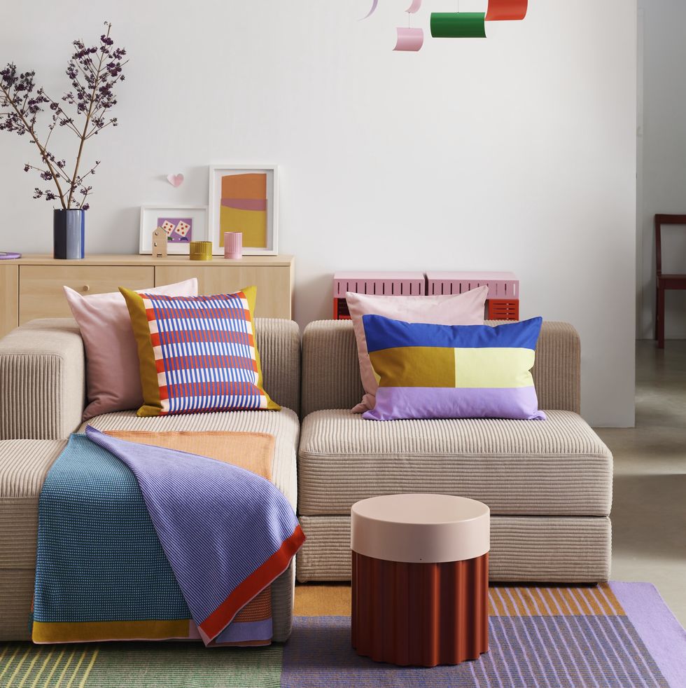a couch with a colorful pillow