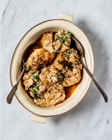 a bowl of stew on white background