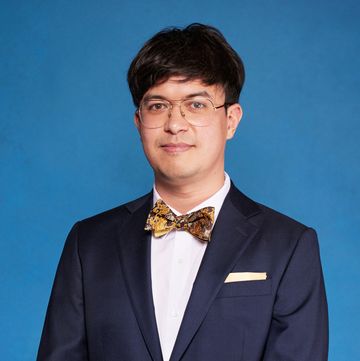phil wang wearing a suit during a portrait for national comedy awards for stand up to cancer