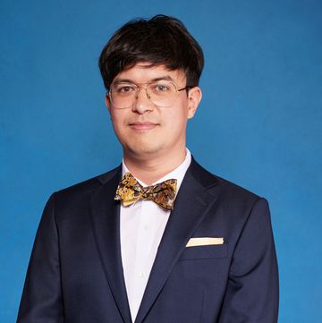 phil wang wearing a suit during a portrait for national comedy awards for stand up to cancer