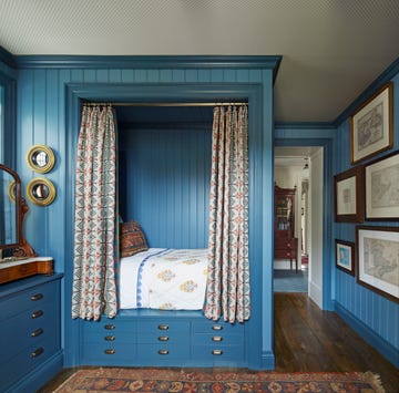 philip mitchell blue bedroom lined with curtains