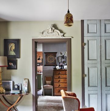 living room with soft colours, reclaimed doors and vintage furniture