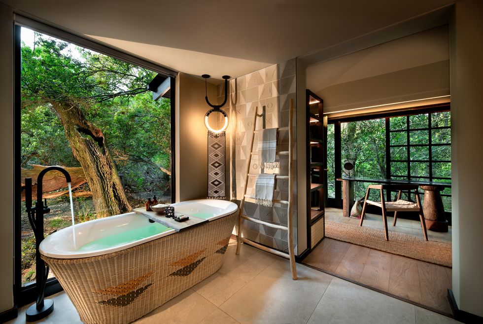 suite bathroom in andbeyond's phinda forest lodge