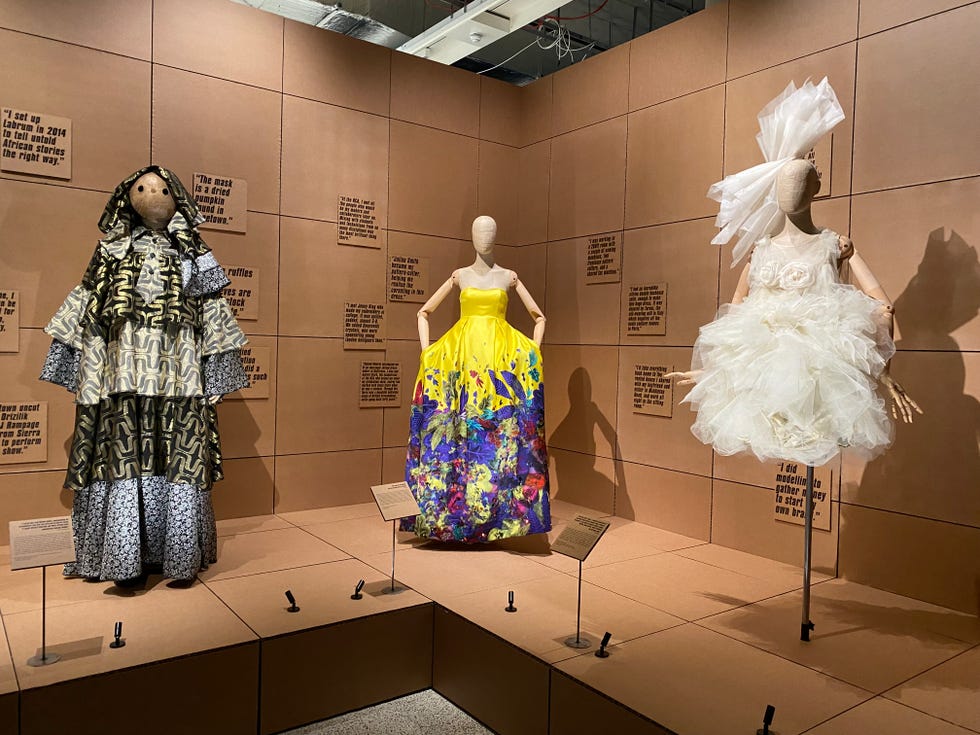 several statues of women in dresses