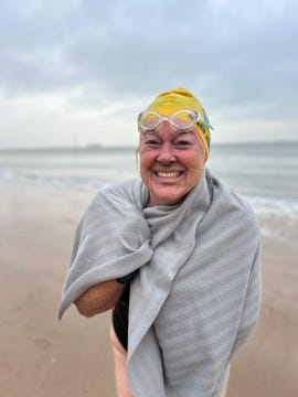 prospective channel swimmer, helen jenkins getting out of the sea.