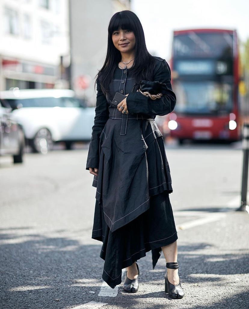 a woman in a black dress