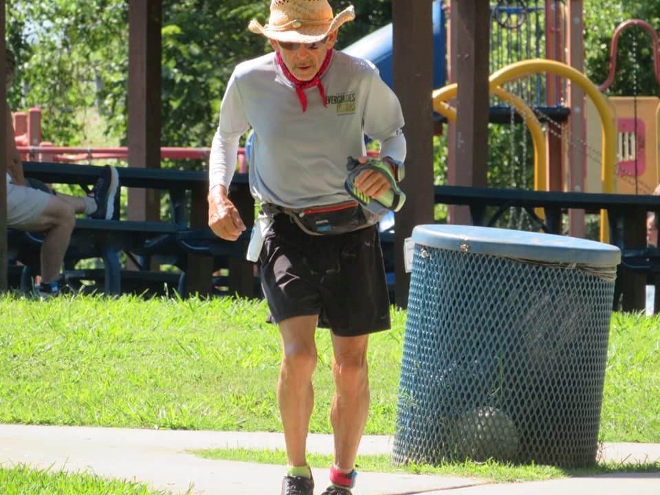Hat, Waste container, Sun hat, Waste containment, Fedora, Calf, Active shorts, Bermuda shorts, Cowboy hat, Park, 