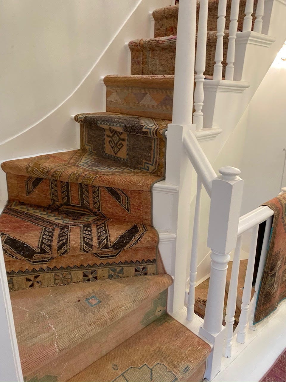 stairs covered with patterned runner carpets