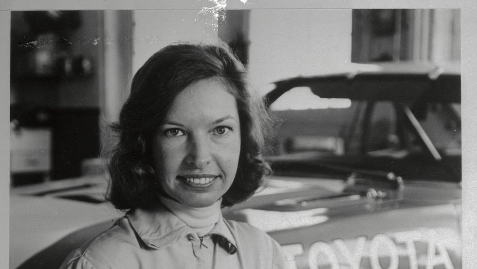 janet guthrie stooping with helmet