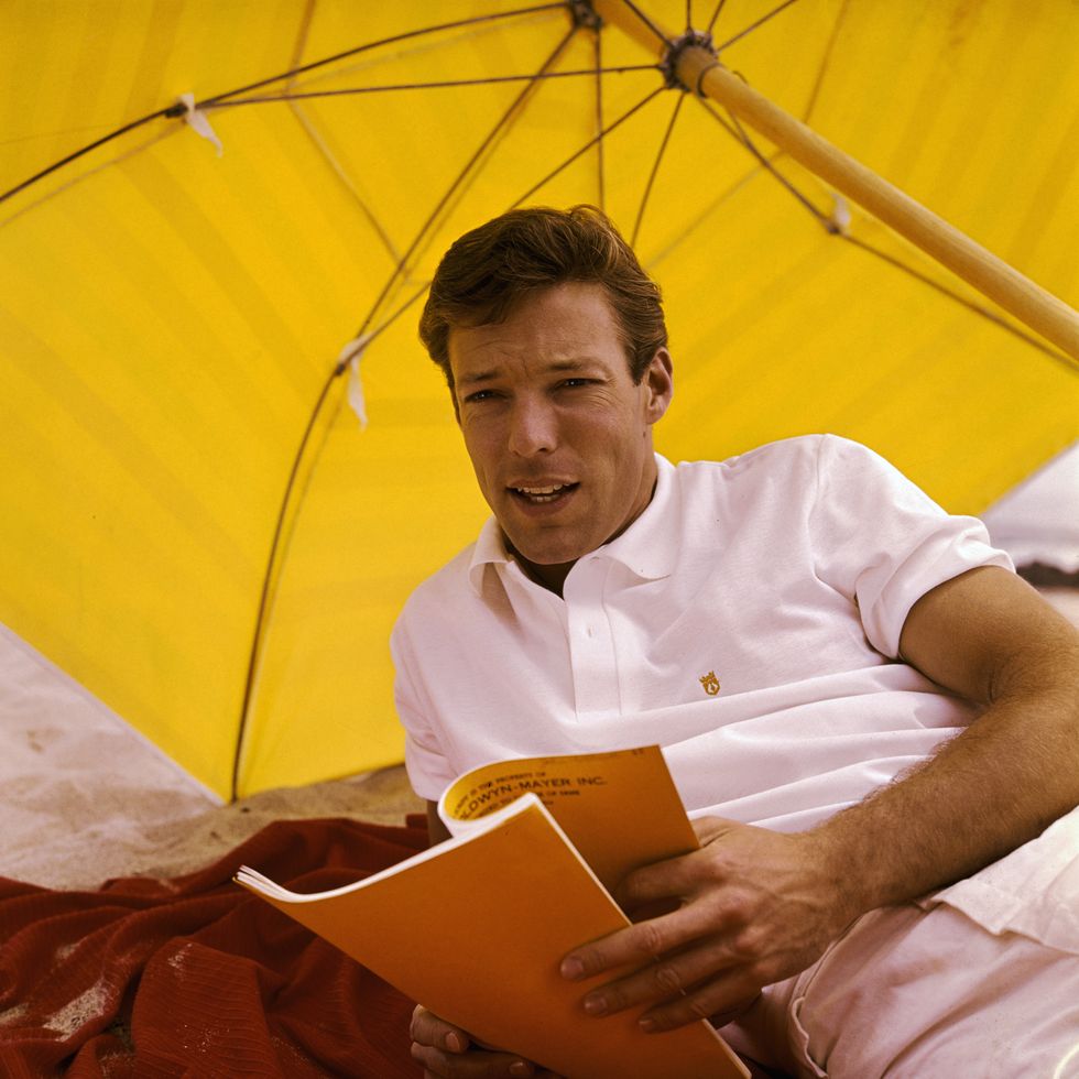richard chamberlain shielded by yellow umbrella