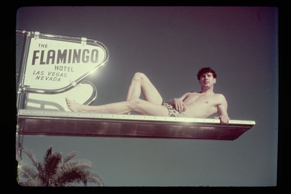 rock hudson lounging on a diving board